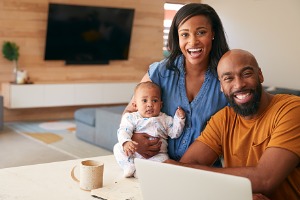 Young family smiling at camera